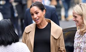 The duchess of sussex loves a good coat. Meghan Markle Wears Oscar De La Renta Coat With Cow Print Pumps At Smart Works