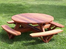 A Round Picnic Table Wooden Picnic Tables Picnic Table Plans Picnic Table