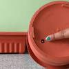 Many books and web sites recommend the addition of stones, pebbles, or pot chards in the bottom of pots to increase drainage. 1