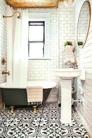 To update the bathroom, they installed white subway tile in splash zones for easier cleaning. Bathroom Low Tech Toilet Roll Holders Remodelista Simple Bathroom Bathroom Tile Designs Subway Tiles Bathroom