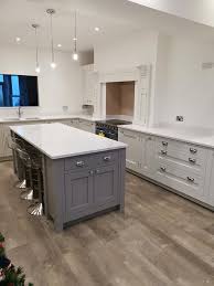 Light grey shaker kitchen with white quartz worktops for kitchens. Ceaserstone Organic White Quartz Worktops And Calacatta Quartz Island