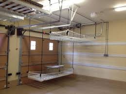 A Pulley System For Storage In The Garage Traditional Garage And Shed By Inviting Diy Overhead Garage Storage Garage Storage Shelves Overhead Garage Storage