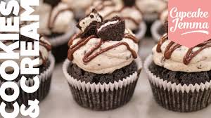 Cookies and cream cupcakes featuring a chocolate cupcake with cookies and cream bar baked into the center. Cookies Cream Oreo Cupcakes Cupcake Jemma Bake At Home Youtube