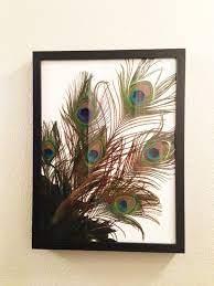 How's that for a unique (and fancy!) peacock decor piece? 40 Unique Peacock Feather Wall Decor Ideas Feather Wall Decor Feather Decor Diy Picture Frames