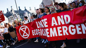 Extinction rebellion (xr for short) wants governments to declare a climate and ecological emergency and take immediate action to address climate change. The Story Behind The Extinction Rebellion Symbol At Climate Protests
