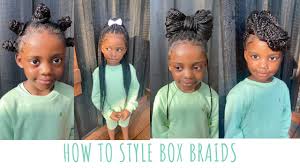 Double puffs crisscrossing on the head top. How To Style Box Braids Kids Knotless Box Braids Styles Youtube