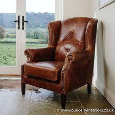 Leather wing armchairs available to buy in store and online at www.curiosityinteriors.co.uk. Leather Armchair Wing Tweed Leather Armchair Curiosity Interiors