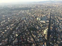 A mix of 16th, 17th and 18th century european buildings are found with modern day businesses near by. Mexico City Signium