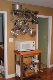 Maybe you would like to learn more about one of these? Pegrail Best Pot Rack Ever Wall Mounted Hangs Between Two Doorways With My Microwave Underneath Stur Kitchen Facelift Unfitted Kitchen Kitchen Renovation