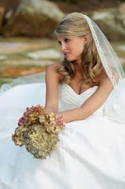 There are various hair styles for medium length hair which looking gorgeous and make your personality special on their wedding day. This Is A Popular Veiled Half Updo Bridal Hairstyle With Soft Side Swept Wedding Hairstyles Medium Length Wedding Hairstyles Half Up Half Down Bride Hairstyles