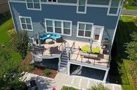 Blue house with stained deck. Deck Color Schemes Popular Deck Color Trends For Your House