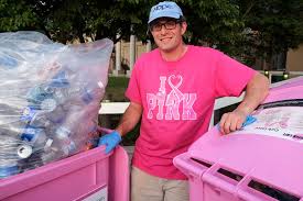 Wraps a stack of new recycling carts sporting the color and symbol for the fight against breast cancer on. Local Man Dedicated To Raising Money For Breast Cancer Research One Recycled Bottle At A Time