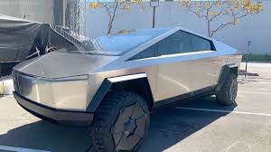 The design of tesla's cybertruck, which was unveiled last week, has received mixed reactions on twitter being called both courageous and ridiculous. New Tesla Cybertruck Redesign Tesla S Controversial Cybertruck To Be Redesigned Creative Bloq Tesla