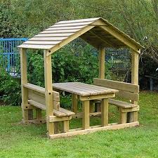 Timber Playground Shelter A Wooden Shelter For Children With Wooden Benches And A Table Built In Gazebo Plans Picnic Table Plans Backyard
