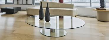 This industrial display box styled coffee table features a seamless blend of function and design. Apollo Glass Offers Customized Glass Tabletops Apollo Glass