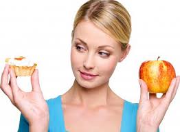 “Many people are emotional eaters, and when they&#39;re stressed or in a bad mood, favorite foods can provide mood elevation,” says Colleen Gerg, ... - Woman-holding-apple-and-tart
