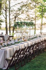 This Beautiful King S Table Is Adorned With Romantic Twinkle Light Candles Garland And A Three Foot Tall Cen Kings Table Outdoor Reception Hanging Centerpiece