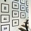 How to hang a gallery wall on a curved staircase ~ an easy tip to hanging picture frames on a curved staircase is to remove the paper from the frames, tape them to the walls where desired and then you are ready to hang the frames. 1