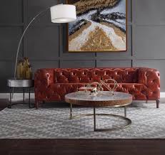 A table that owns the space it occupies, while bringing maximum versatility. Orsin Merlot Button Tufted Top Grain Leather Sofa