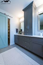 Modern Meets Farmhouse In This Custom Master Bathroom With Sliding Barn Door Full Backsplash With Arabesq Countertop Storage Diy Bathroom Bathroom Floor Tiles