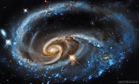 Appearing as a slightly stretched, smaller version of our milky way, the peppered blue and red spiral arms are anchored together by the prominent horizontal Facebook