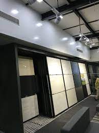 Ceramics Showroom Wall Panels Sliding Porcelain Tile Display Lightingfortiles Tracklight Showroom Interior Design Showroom Design Tile Showroom