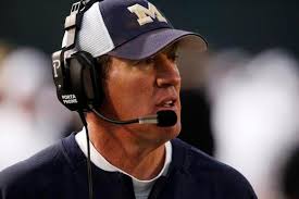 Students wage brief protest after Mullen ousts football coach Dave Logan