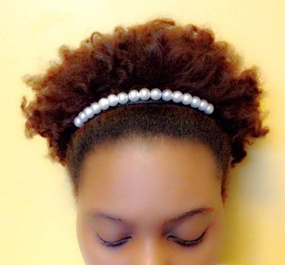 Pearl headband on natural curls, AI generated