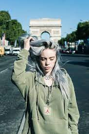 Eilish Knows How To Effortlessly Pair Sneakers With Baggy Layered Looks In Paris She Debuted New Colorways Of The Air Jorda Billie Eilish Billie Celebrities