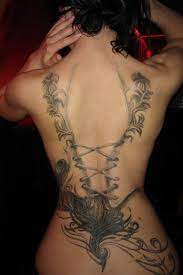 The Woman Back Tattoo Is One Of The Locations Of The Most Requested Body The Back Allows The Widest Poss Feminine Back Tattoos Corset Tattoo Back Tattoo Women
