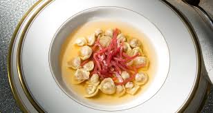 Maybe you would like to learn more about one of these? Tortellini Ripieni Di Prosciutto Crudo Di Parma E Lonza Di Maiale Su Brodo Tiepido Di Parmigiano