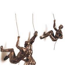 Name one of the basic necessities of life. Climbing Man Wall Sculpture You Ll Love In 2021 Visualhunt