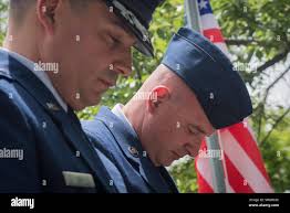 U.S Air Force Col. Juan Alvarez (left), 377th Mission Support Group  commander, and presiding officer, shakes hands with Lt. Col. Daniel Rigsbee,  outgoing 377th Force Support Squadron commander, at a change of