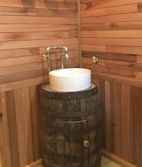 cedar bathroom with whiskey barrel sink