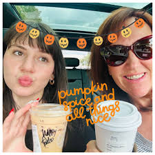 Moms enjoying pumpkin spice lattes with daughters