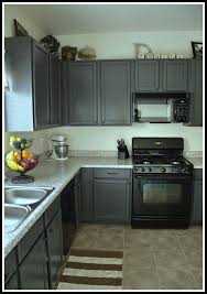 gray kitchen cabinets with black