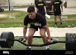 Army Reserve Soldier, Pfc. Diego Ruelas, 77th Quartermaster Group, 4th  Sustainment Command (Expeditionary), El Paso, Texas, performs a deadlift  during the Army Combat Fitness Test, which was the mystery event for the