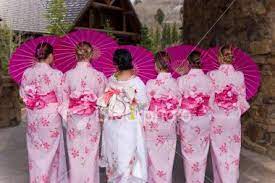 Traditional Japanese Wedding Bride And Bridesmaids In Colorful Pink Japanese Wedding Traditions Japanese Wedding Theme Traditional Japanese Wedding