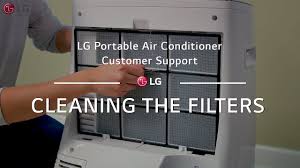 Lg portable air conditioner in a living room next to a couch. Lg Portable Ac Cleaning The Filters Youtube