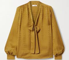 A scarf and a long, tailored coat glam up comfy distressed jeans; Habitually Chic Wfh Outfit Inspiration From Jennifer Aniston S Wardrobe On The Morning Show