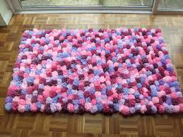 Now tie even tighter with the rolls out. 7 Best Pom Pom Rug Ideas Pom Pom Rug Pom Pom Pom Pom Crafts