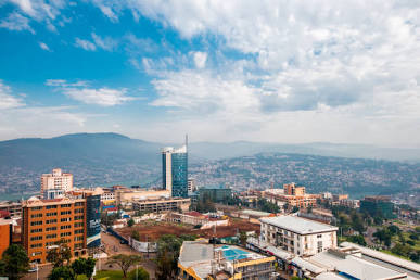 looking down at modern Kigali city center and skyscrapers under blue sky