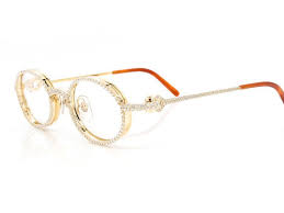 Cartier's men's 18k gold framed glasses are 2 1/8 in height and 5 1/2 in width across the front. Cartier Iced Out Glasses Glass 14k Yellow Gold 7 42ctw Cartier Glasses Men Jewelry Stand Jewelry Editorial