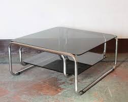 Metal tube, glass, mdf storage : Vintage Chromed Coffee Table With Black Glass Top 1970s 117373