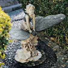 A Fairy S Wondrous Butterfly Ride Statue Garden Statues Fairy Garden Fairy Statues