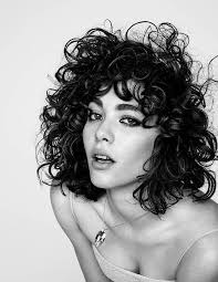Shaggy Shoulder Length Dark Brunette Hair With Curly Bangs Hairstyles For Short Curly Hair Wo Curly Hair Styles Curly Hair Styles Naturally Curly Hair Women