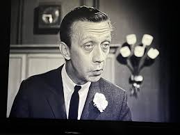 James Milhollin in his final role as a boot salesman