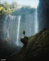 Man Standing By Tumpak Sewu Waterfalls Indonesia Premium Image By Rawpixel Com Luke Stackpoole Aerial View Waterfall Man Images