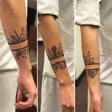 These arm band tattoos represent masculinity of a man. Wildflower Inspired Arm Band By Derek At 550 Tattoo Durango Co Tattoos