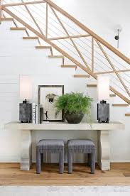 Our beautifully crafted consoles add elegance to any room. Against A White Shiplap Staircase Wall Gray Velvet Stools Sit Under A Concrete Console Table Li Foyer Decorating Shiplap Staircase Wall Concrete Console Table